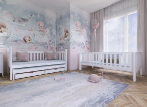 Hvid daybed med skuffer og hvid tremmeseng i et børneværelse med havfrue-tema.